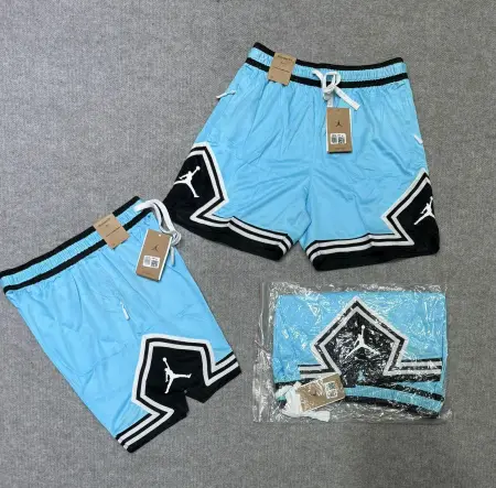 SHORT JORDAN 23 LISO CELESTE/NEGRO